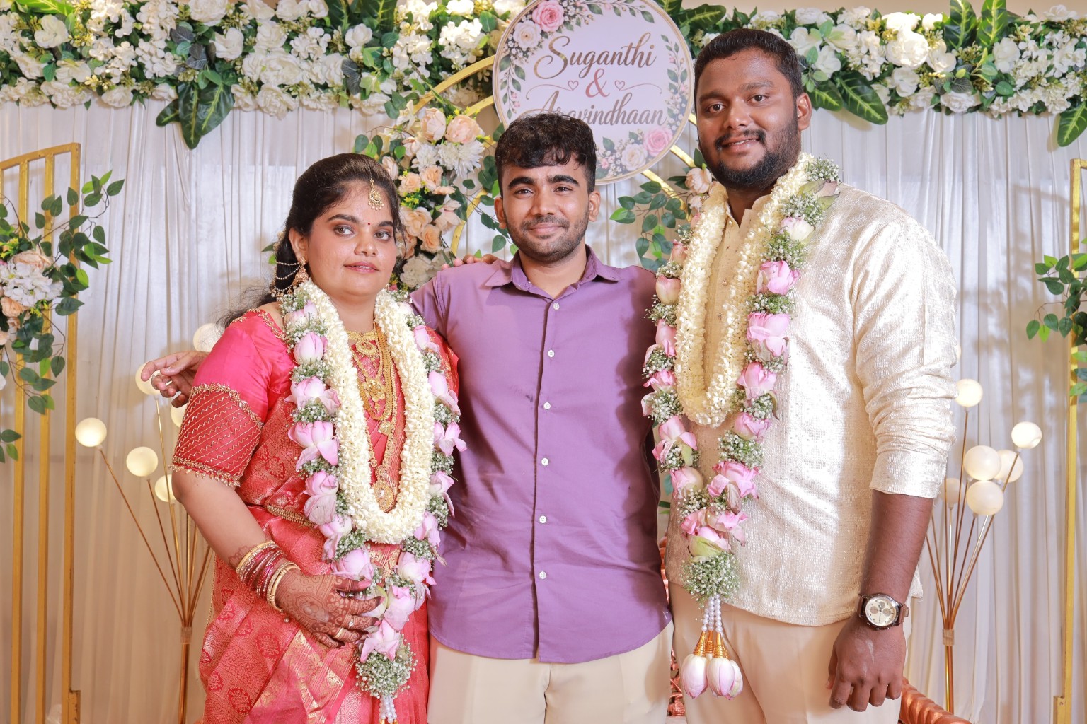 Aravindhaan & Suganthi posing with a loved one