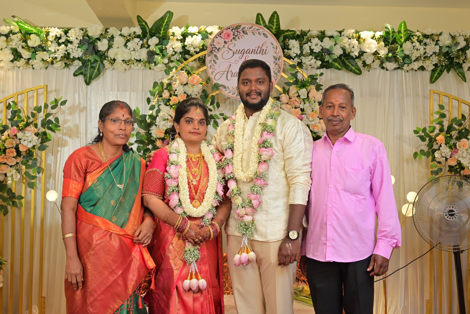 Aravindhaan & Suganthi with two loved ones at the celebration